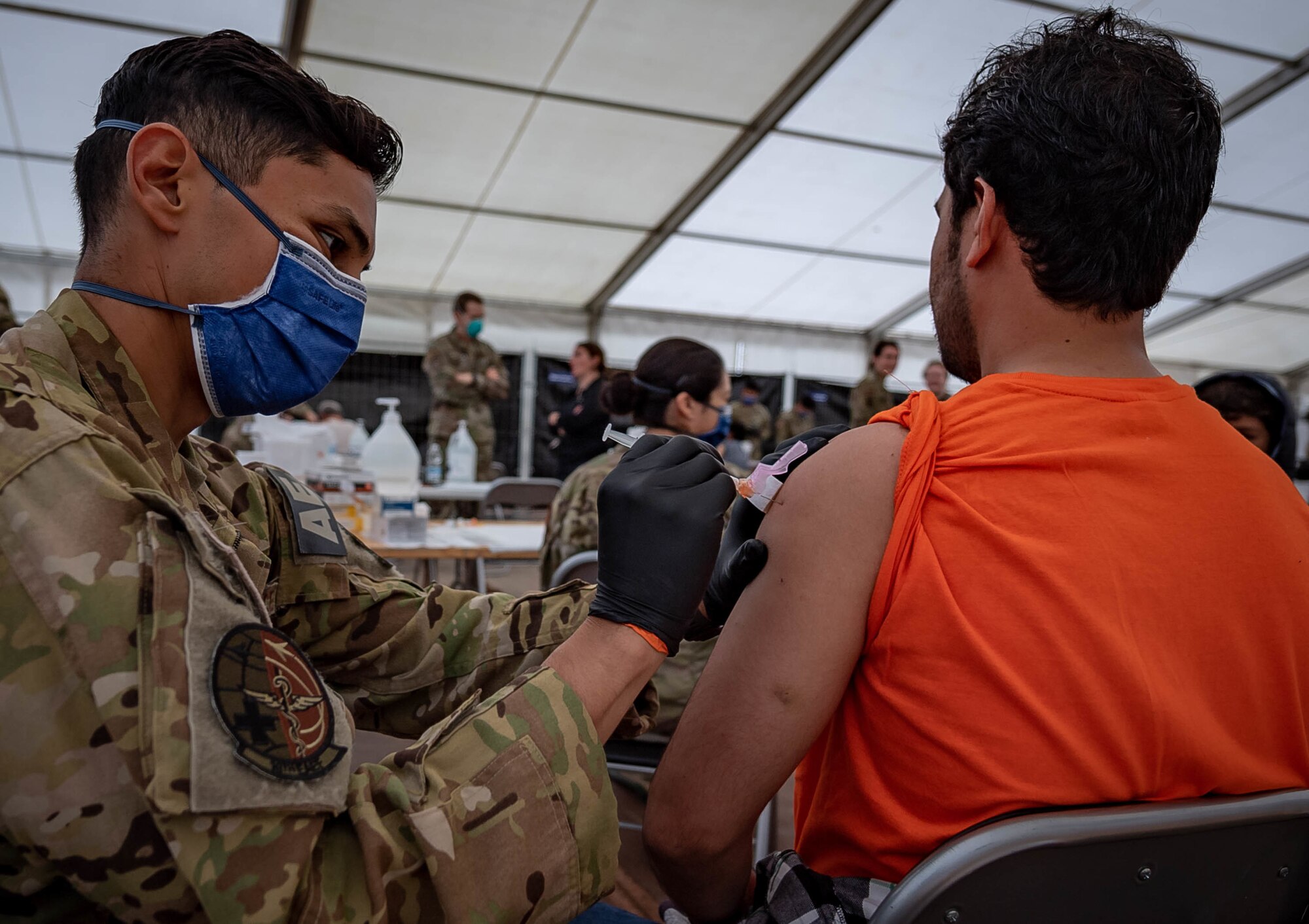 Evacuee receives vaccine.