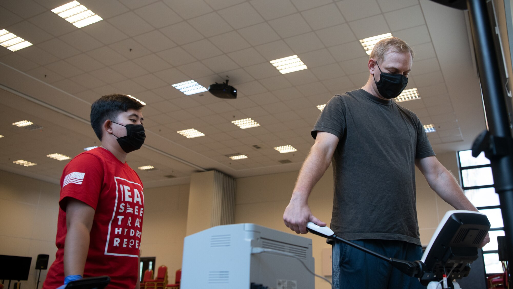 teacher instructs student in class