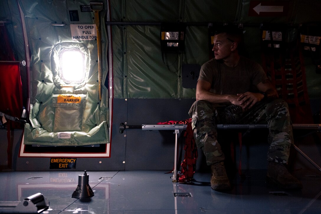 a crew chief prepares for a flight