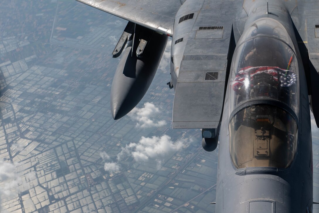 A U.S. Air Force F-15E Strike Eagle assigned to the 494th Expeditionary Fighter Squadron receives fuel from a KC-135 Stratotanker