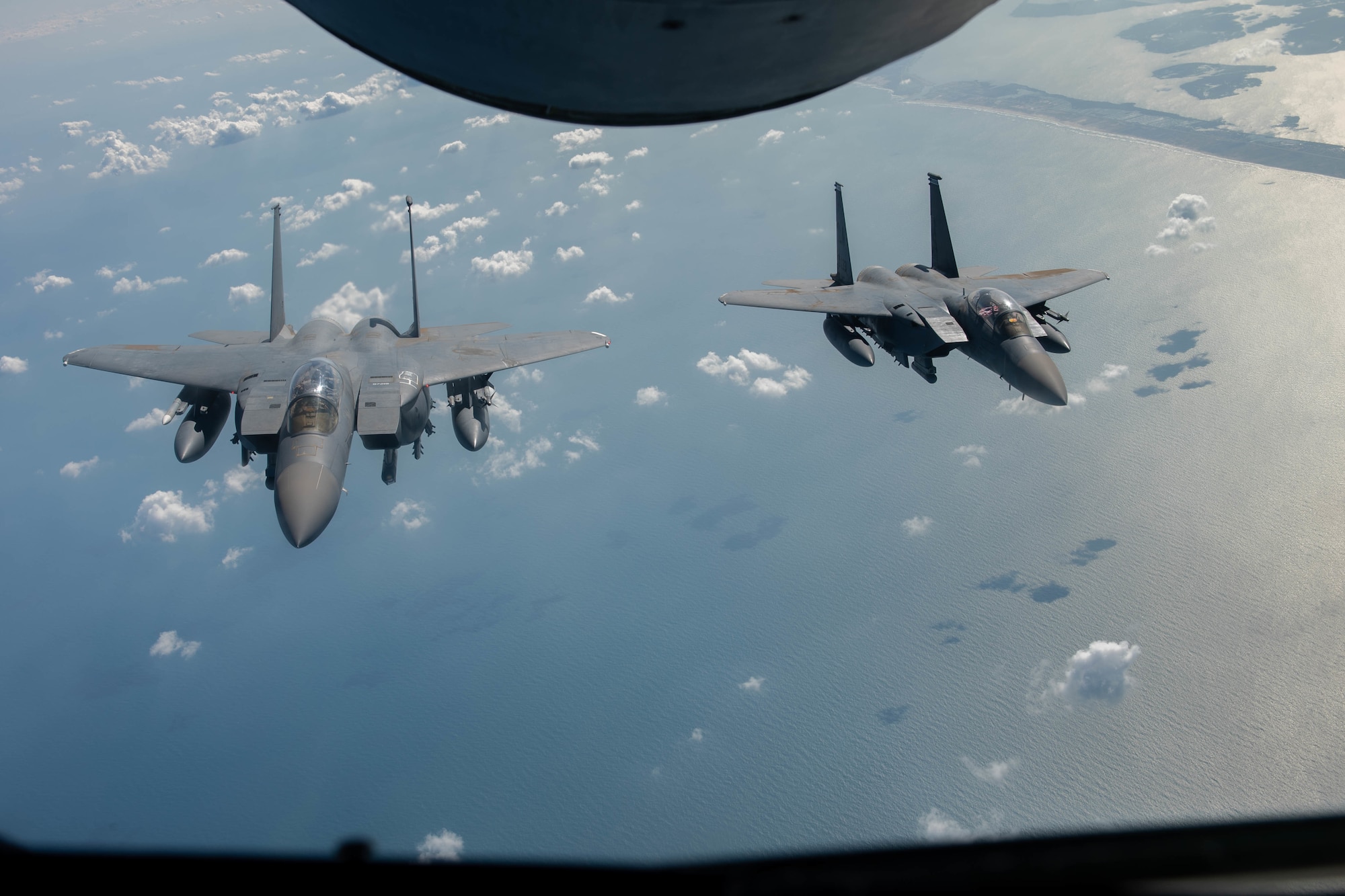 A pair of U.S. Air Force F-15E Strike Eagles assigned to the 494th Expeditionary Fighter Squadron, fly in formation over the Mediterranean Sea during Bright Star 21