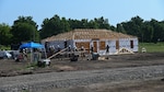 Members from the 175th Wing, Maryland Air National Guard, and the 123rd Airlift Wing, Kentucky Air National Guard, build a home for Cherokee veterans in Tahlequah, Oklahoma, Aug. 3, 2021, as part of the Defense Department’s Innovative Readiness Training program.