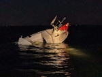 The Coast Guard, and the Beach Haven Volunteer Fire Department rescued six boaters after their 30-foot white pleasure craft struck a fixed aid to navigation in the vicinity of Ham Island, Sept. 19, 2021. The boaters were safely recovered and taken back to shore where local emergency medical services personnel transported them to various local hospitals. (U.S. Coast Guard photo/Released)