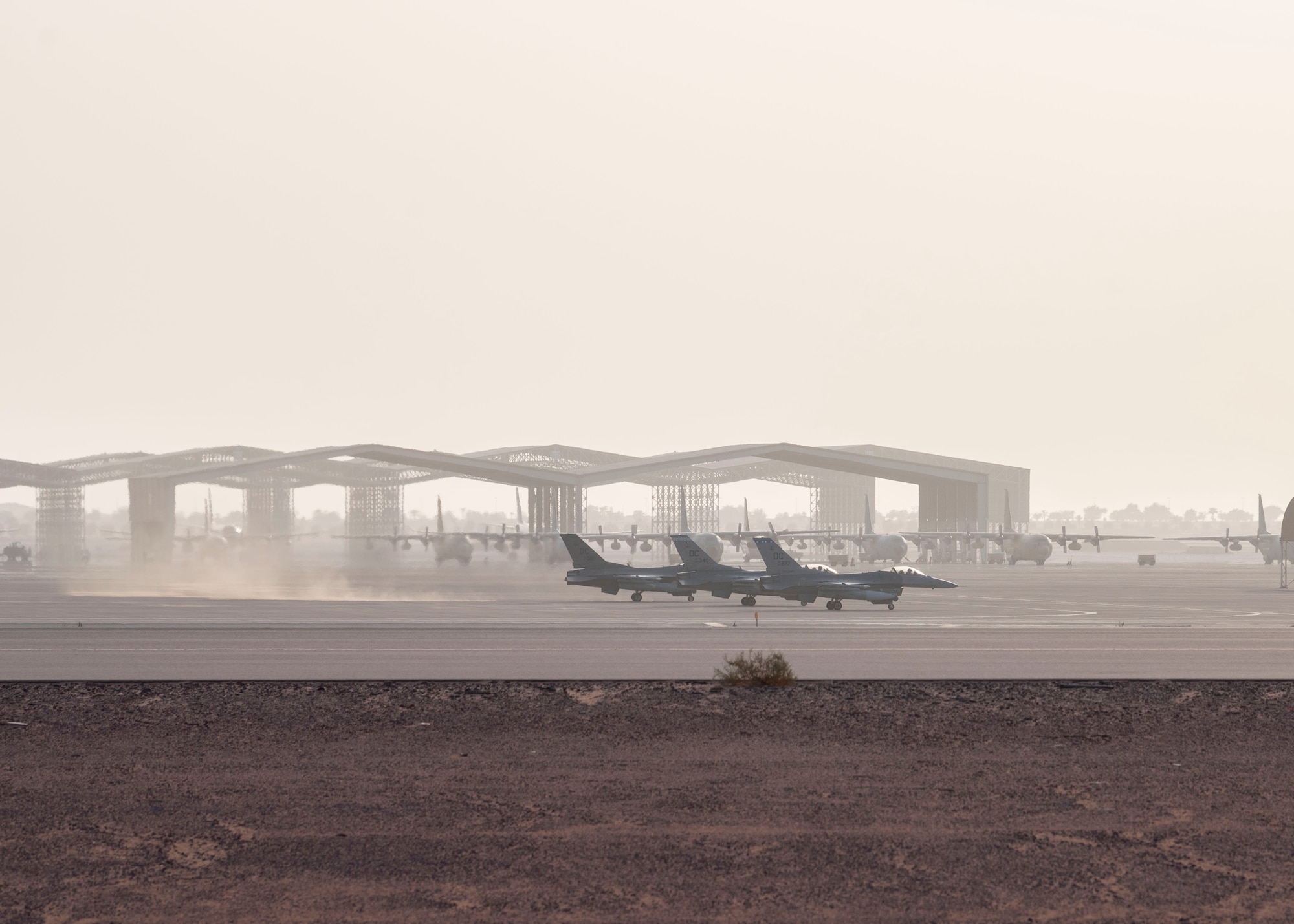 Three U.S. Air Force F-16 Fighting Falcons assigned to the 121st Expeditionary Fighter Squadron prepare for takeoff from Prince Sultan Air Base, Kingdom of Saudi Arabia, prior to flying to Al Udeid Air Base, Qatar for Exercise Sky Shield III, July 31, 2021.  Sky Shield is a bilateral defensive counter air and combat search and rescue exercise designed to validate U.S. Air Forces Central and Qatar Emiri Air Force’s combined capability to defend regional airspace. The event allowed the 378th Air Expeditionary Wing to demonstrate its agile combat employment capabilities of repositioning forces in various locations and rapidly generating combat airpower. (U.S. Air Force photo by Staff Sgt. Caleb Pavao)
