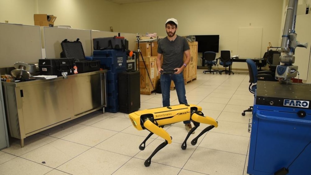 NSWCPD ADAPT.VE Lab engineer with robot