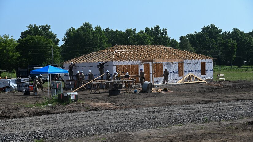 National Guardsmen build a home.