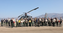U.S. Army Soldiers from 23rd Brigade Engineer Battalion, 1-2 Stryker Brigade Combat Team, assigned to Joint Base Lewis-McChord, Washington, pose for a group photo at Nervino Helibase in front of a civilian aircraft used to carry supplies to and from fires in support of the Department of Defense wildland firefighting response on the Dixie Fire in Plumas National Forest, California, Sept. 14, 2021. U.S. Army North, U.S. Northern Command’s Joint Force Land Component Command remains committed to providing flexible DoD support to the National Interagency Fire Center to respond quickly and effectively to assist our local, state, and federal partners in protecting people, property, and public lands.