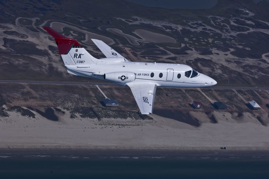 A T-1A Jayhawk flies along the Texas coast during a training mission