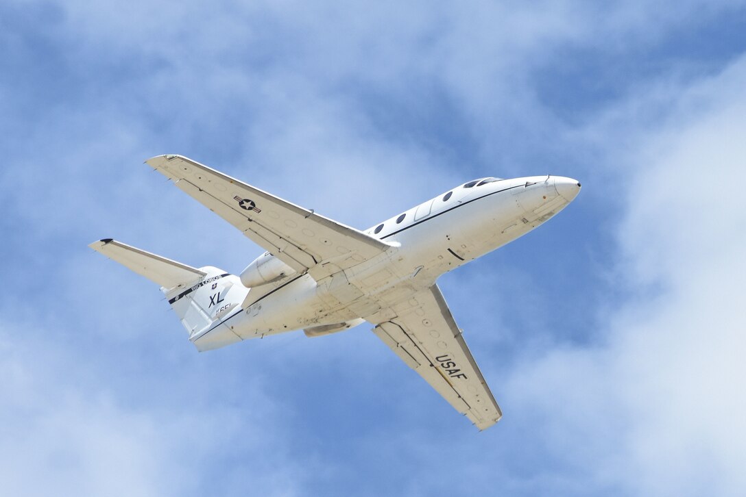 A T-1A Jayhawk performs a flyover