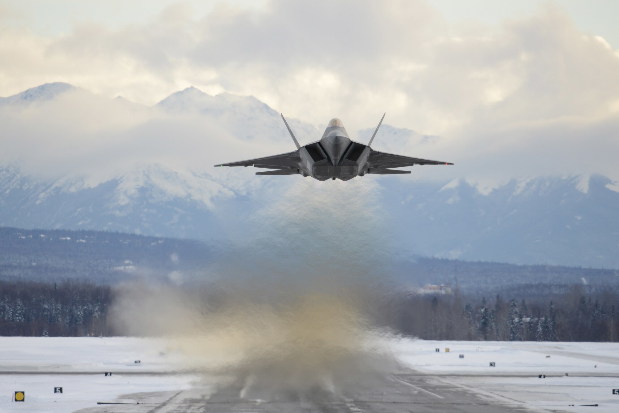 An Air Force F-22 Raptor assigned to the 3rd Wing flies over Joint Base Elmendorf-Richardson, Alaska