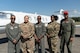 U.S. Air Force Capt. Sidney Ganison, C-21 pilot, stands next to Staff Sgt. Rachel Kinsey, Aviation Resource Management NCOIC, Capt. Johnny Frye, C-21 pilot, Master Sgt. Shina Williamson, 458th Airlift Squadron superintendent, and Capt. Kyle Green, C-21 pilot, (left to right) during a trip to Tuskegee, Alabama, Sept. 28, 2021. The group made history as being the first all-African American crew to land the C-21 at Alabama's historic Tuskegee Airfield. (U.S. Air Force photo by 1st Lt. Sam Eckholm)