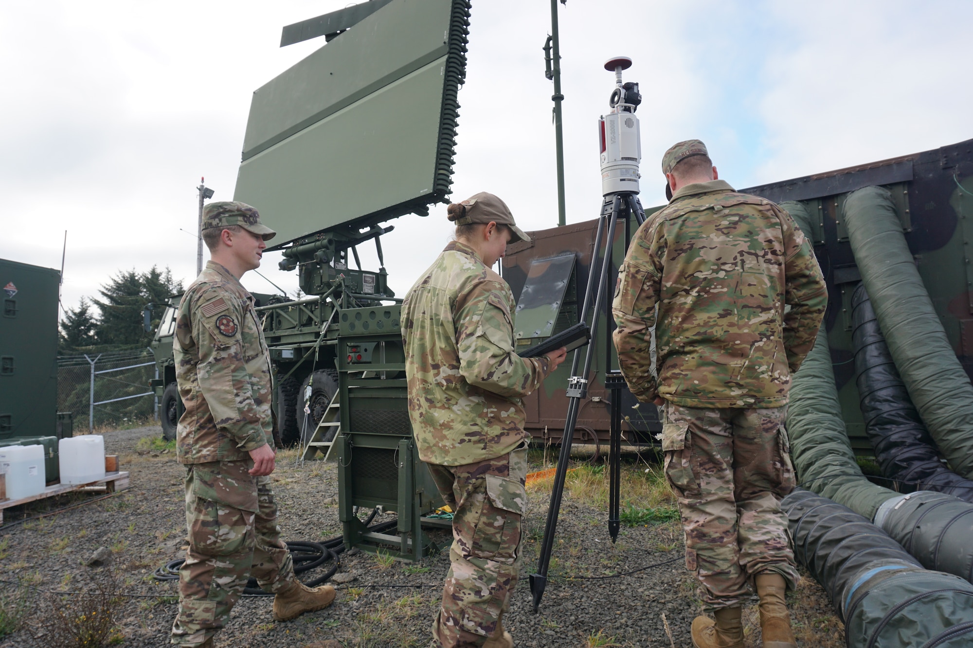 photo of U.S. Airmen working near TPS-75 radar