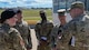 Col. Mark Dmytryszyn, 2nd Bomb Wing commander, converses with Maj. Gen. Andrew Gebara, 8th Air Force and Joint-Global Strike Operations Center commander, and leaders of the 2nd Security Forces Squadron at Barksdale Air Force Base, Louisiana,  Sept. 28, 2021. Gebara visited multiple units during his visit, immersing himself into Barksdale’s Stiker Nation. (U.S. Air Force photo by Airman 1st Class Jonathan E. Ramos)