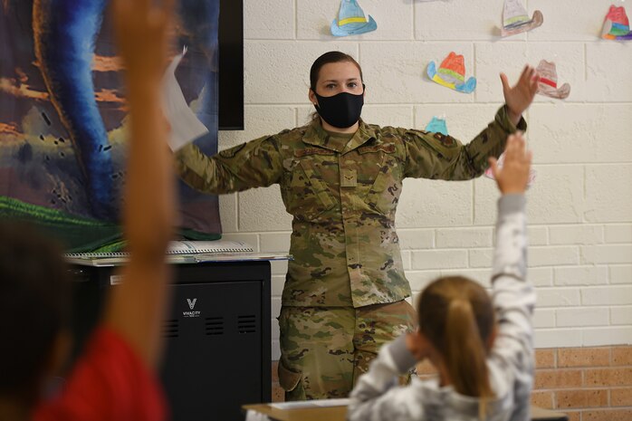 U.S. Air Force Staff Airman 1st Class Darlena Reynolds, 97th Civil Engineer Squadron (CES) emergency management apprentice, asks L. Mendel Rivers Elementary 4th grade students questions about tornadoes, during a visit to their school on Altus Air Force Base, Oklahoma, Sep. 28, 2021. The 97th CES Emergency Management Flight held events at the Rivers and Navajo Elementary Schools, to put on a fun, interactive water tornado activity for their students as well as local homeschoolers. (U.S. Air Force photo by Tech. Sgt. Robert Sizelove)