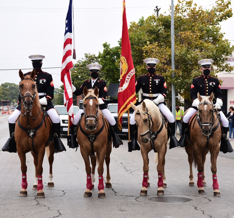 The Marine Corps mounted Color Guard walks down the parade route in the Santa Maria Elks Parade in Santa Maria, Calif., Sept. 4, 2021. (U.S. Space Force photo by Airman First Class Tiarra Sibley)