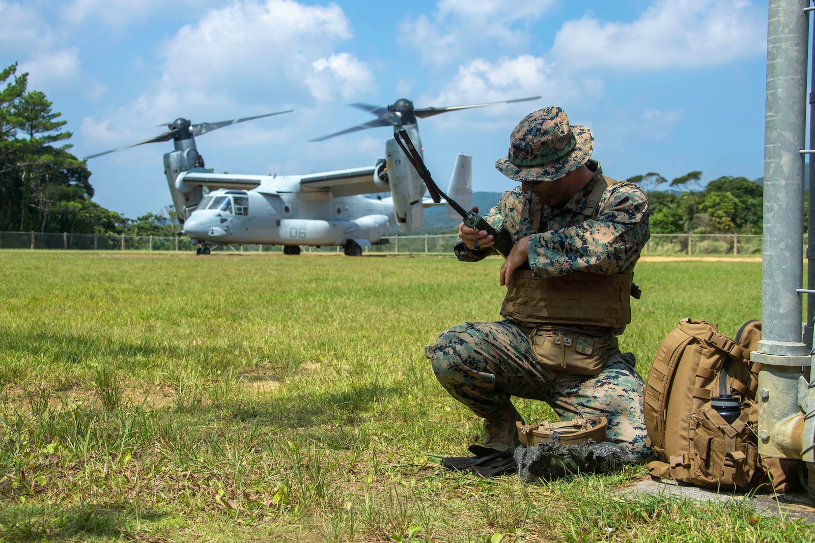 U.S. Marine Corps Staff Sgt. Devon Wheeler, a rifleman assigned to 2d Battalion, 3d Marines, 3d Marine Division, establishes communications during Indo-Pacific Warfighting Exercise in the Northern Training Area on Okinawa, Japan, August 31, 2021. This force-on-force exercise demonstrated the ability to seize and defend key-maritime terrain and provided an opportunity to employ techniques to rapidly establish forward arming and refueling points. 2/3 is currently attached to 4th Marines as a part of the Unit Deployment Program. (U.S. Marine Corps photo by Lance Cpl. Scott Aubuchon)