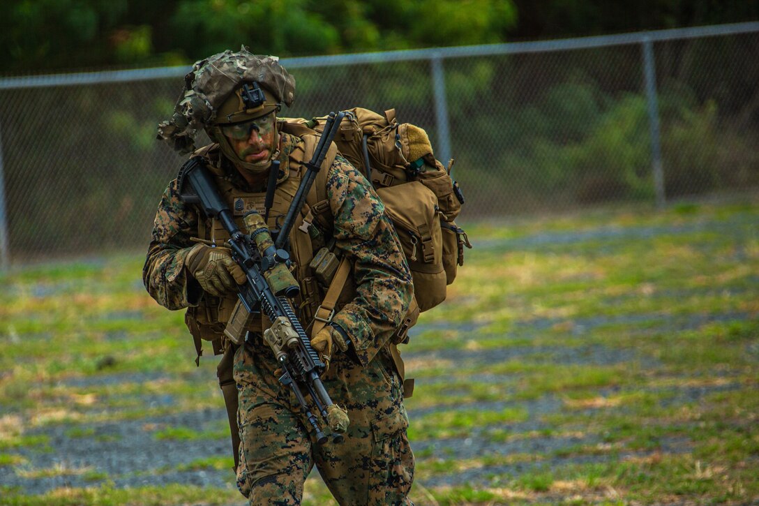 U.S. Marine Corps Gunnery Sgt. Vincent Havelaar, platoon sergeant, 1st Battalion, 3d Marines, conducts offensive operations during Large Scale Exercise 21 at Marine Corps Training Area Bellows, Hawaii, Aug. 10, 2021. LSE21 is a live, virtual, and constructive exercise employing integrated command and control, intelligence, surveillance, reconnaissance, and sensors across the joint force to expand battlefield awareness, share targeting data, and conduct long-range precision strikes in support of naval operations in a contested and distributed maritime environment. (U.S. Marine Corps photo by Cpl. Jacob Wilson)