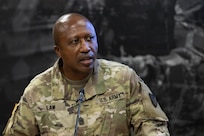 Command Sgt. Maj. Kenneth F. Law, U.S. Army Financial Management Command senior enlisted advisor, delivers a speech after presenting Sgt. Maj. Damien Russell, USAFMCOM Operations senior enlisted advisor, with the 837th Maj. Gen. Nathan Towson Medallion during a special ceremony at the Maj. Gen. Emmett J. Bean Federal Center in Indianapolis Aug. 26. The Towson Medallion was established by the Army Finance Corps Association on May 7, 1993, and is awarded in recognition of demonstrated exemplary contribution and service to the Army Finance Corps. (U.S. Army photo by Mark R. W. Orders-Woempner)