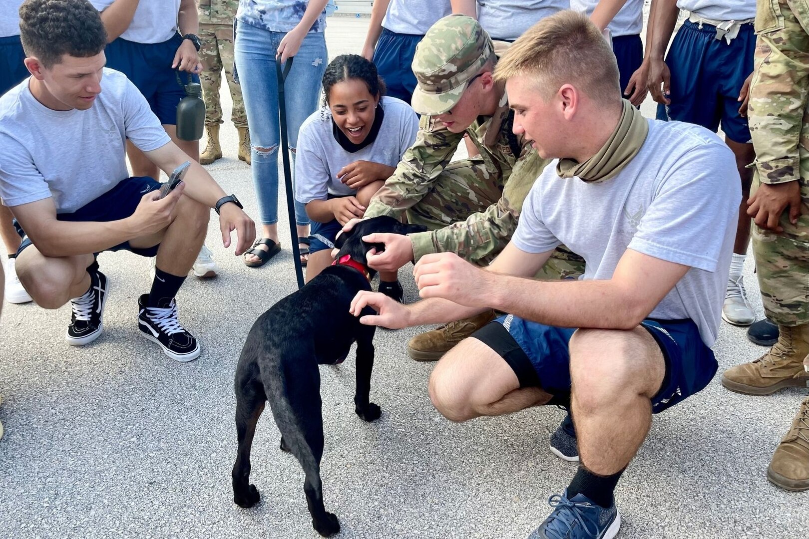 Airmen and puppy