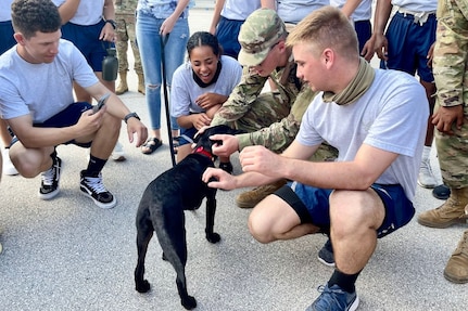 Airmen and puppy