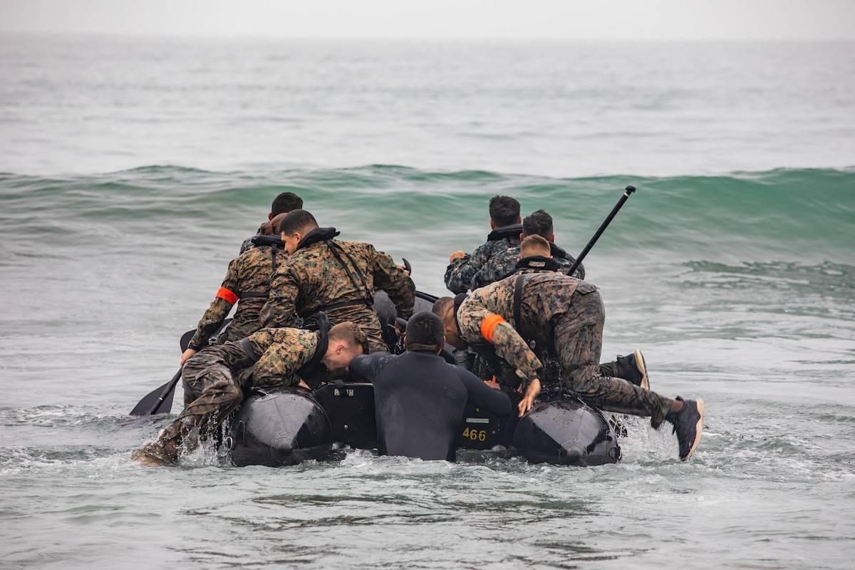 U.S., Brazilian, Chilean, Colombian, Mexican and Peruvian Marines and members of the Jamaican Defense Force utilize a combat rubber raiding craft, at sea, during an amphibious training evolution at the Base de Infanteria de Marina, Peru, Sept. 27, 2021, during exercise UNITAS LXII.