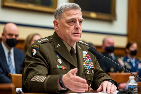 A military officer speaks at a hearing.