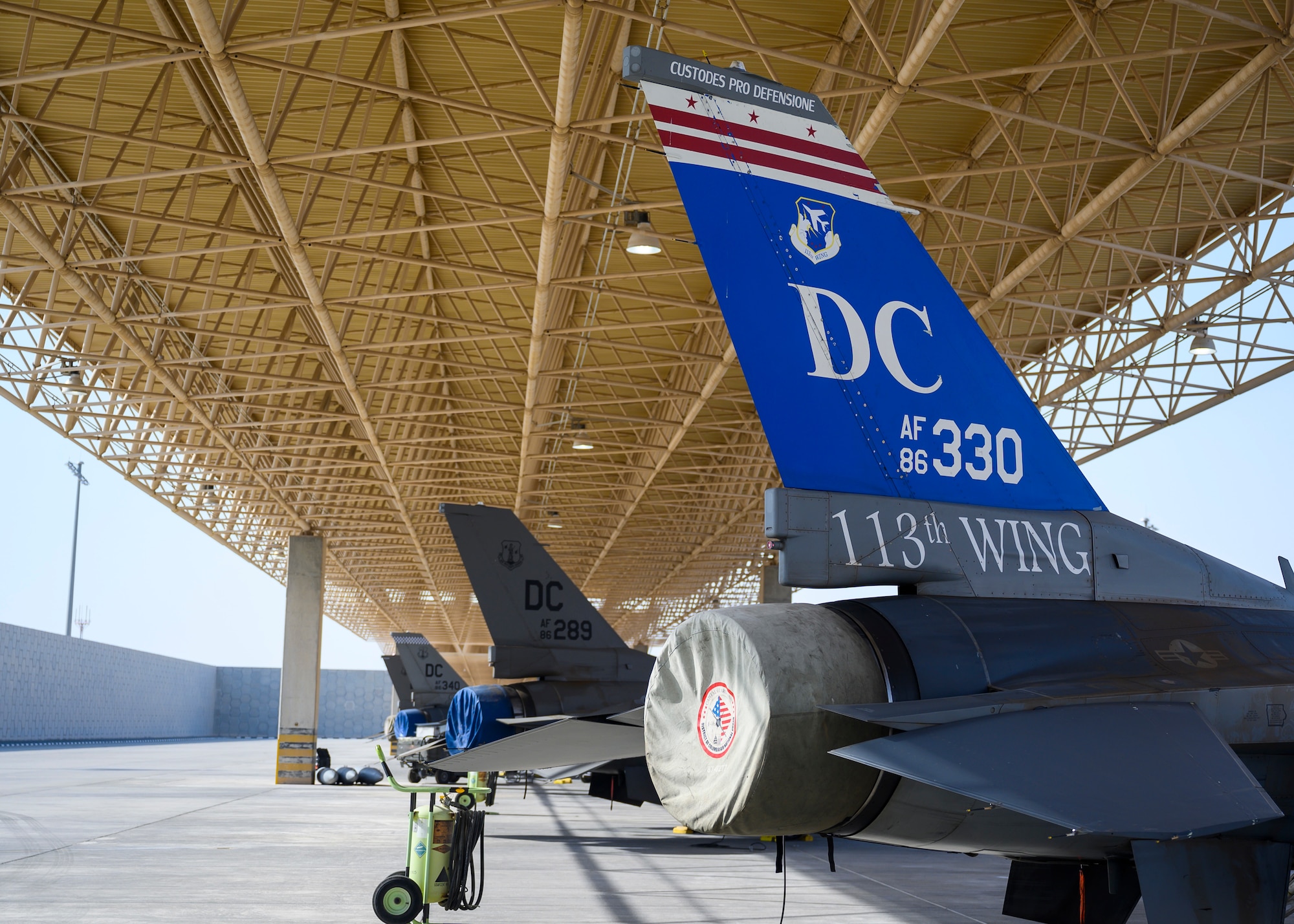 A contingent of U.S. Air Force F-16 Fighting Falcons sit on the flightline at Al Udeid Air Base, Qatar, during Exercise Sky Shield III Aug. 3, 2021. Sky Shield is a bilateral defensive counter air and combat search and rescue exercise designed to validate U.S. Air Forces Central and Qatar Emiri Air Force’s combined capability to defend regional airspace. The event allowed the 378th Air Expeditionary Wing to demonstrate its agile combat employment capabilities of repositioning forces in various locations and rapidly generating combat airpower.  (U.S. Air Force photo by Senior Airman Samuel Earick)
