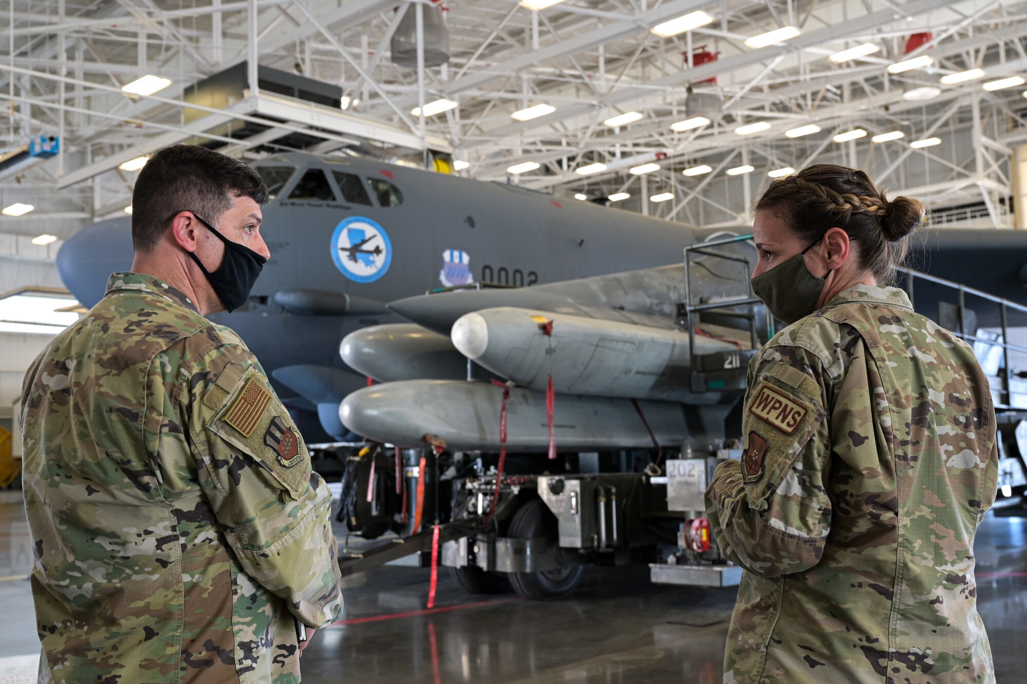 Maj. Gen. Andrew Gebara, 8th Air Force and Joint-Global Strike Operations Center commander, receives a briefing from Tech. Sgt. Marcella Phillips, 2nd Maintenance Group loading standardization crew chief, at Barksdale Air Force Base, Louisiana, Sept. 28, 2021. As a commander, Gebara is responsible for the service’s bomber force and airborne nuclear command and control assets, encompassing approximately 21,000 Airmen across six installations. (U.S. Air Force photo by Airman 1st Class Jonathan E. Ramos)