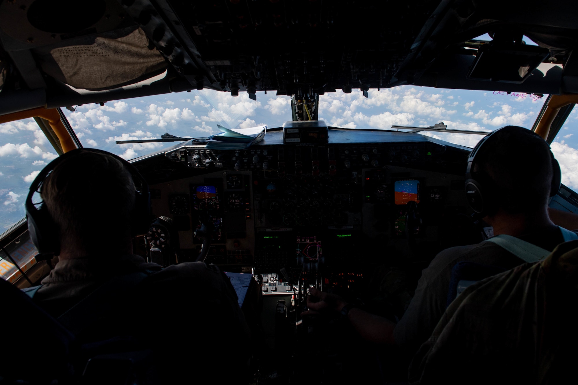 U.S. Air Force Capt. Ryan Turner, 93rd Expeditionary Air Refueling Squadron instructor pilot and flight safety officer (left), and 1st Lt. Graham McCaninch, 93rd EARS KC-135 Stratotanker pilot (right), fly over Egypt during Bright Star 21