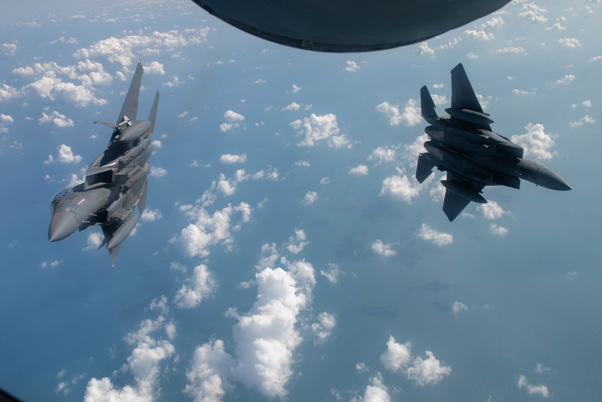 A pair of U.S. Air Force F-15E Strike Eagles assigned to the 494th Expeditionary Fighter Squadron, fly in formation over the Mediterranean Sea during Bright Star 21