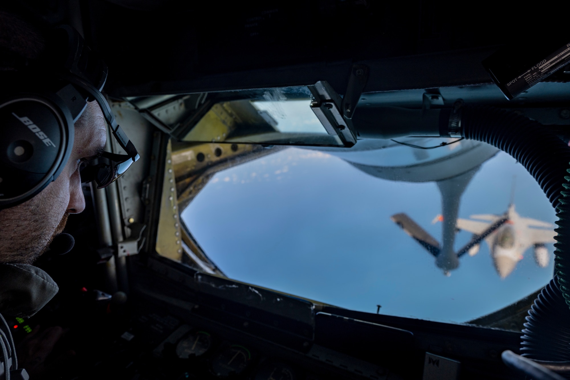 A KC-135 Stratotanker boom operator assigned to the 93rd Expeditionary Air Refueling Squadron, delivers fuel to an F-16 Fighting Falcon from the Egyptian Armed Forces