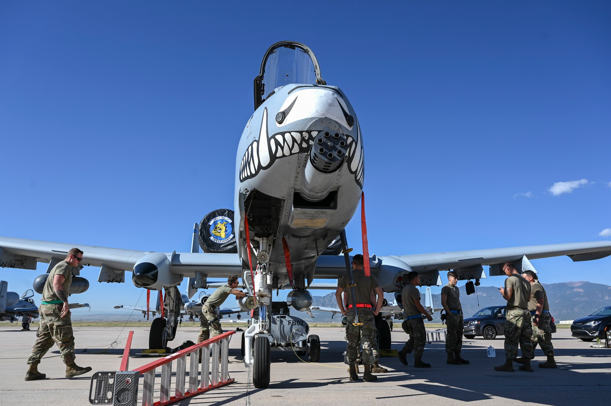 A photo of Airmen working on a plane.