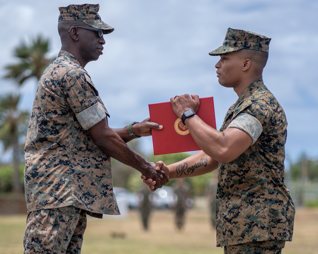 U.S. Marine Corps Lt. Col. George R. Gordy IV, Commanding Officer of 3d Battalion, 3d Marines, awards Lance Cpl. Tercell Byrd, a rifleman with 3d Battalion, 3d Marines, the Navy and Marine Corps Medal, Marine Corps Base Hawaii, June 30, 2021. Byrd received the Navy and Marine Corps Medal for his heroic actions on 28 April 2018. Byrd is a native of Newport News, Virginia. (U.S. Marine Corps photo by Cpl. Juan Carpanzano)