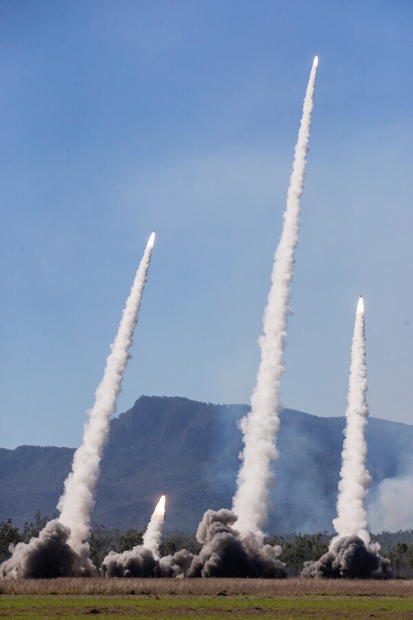 U.S. Marine Corps High Mobility Artillery Rocket Systems with 3d Battalion, 12th Marines, 3d Marine Division, and U.S. Army HIMARS with Alpha Battery, 1st Battalion, 94th Field Artillery Regiment, 12th Field Artillery Brigade, fire H185 RRPRS during Exercise Talisman Sabre 21 on Shoalwater Bay Training Area, Queensland, Australia, July 18, 2021. TS21, the ninth iteration and conducted since 2005, occurs biennially across Northern Australia. Australian, U.S. and other multinational partner forces use Talisman Sabre to enhance interoperability by training in complex, multi-domain operations scenarios that address the full range of Indo-Pacific security concerns. (U.S. Marine Corps photo by Lance Cpl. Ujian Gosun)