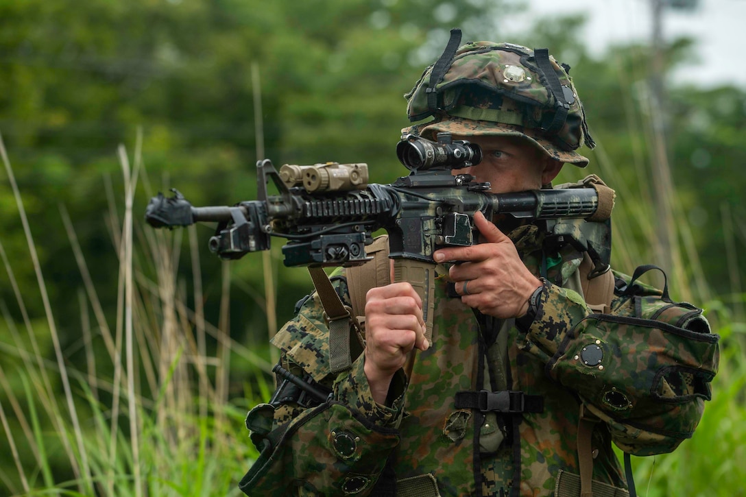 U.S. Marine Corps Sgt. Trever Greer, a rifleman with 2d Battalion, 2d Marines, engages in realistic combat training supported by the Japanese Ground Self-Defense Force Fuji Training Center during exercise Shinka at Combined Arms Training Center, Camp Fuji, Japan June 30, 2021. Shinka and exercises like it exemplify a shared commitment to innovative training that produces lethal, ready, and adaptable, forces capable of decentralized operations across a wide range of missions. 2/2 is forward-deployed in the Indo-Pacific under 4th Marines, 3d Marine Division. Greer is a native of Midland, Texas. (U.S. Marine Corps photo by Lance Cpl. Scott Aubuchon)
