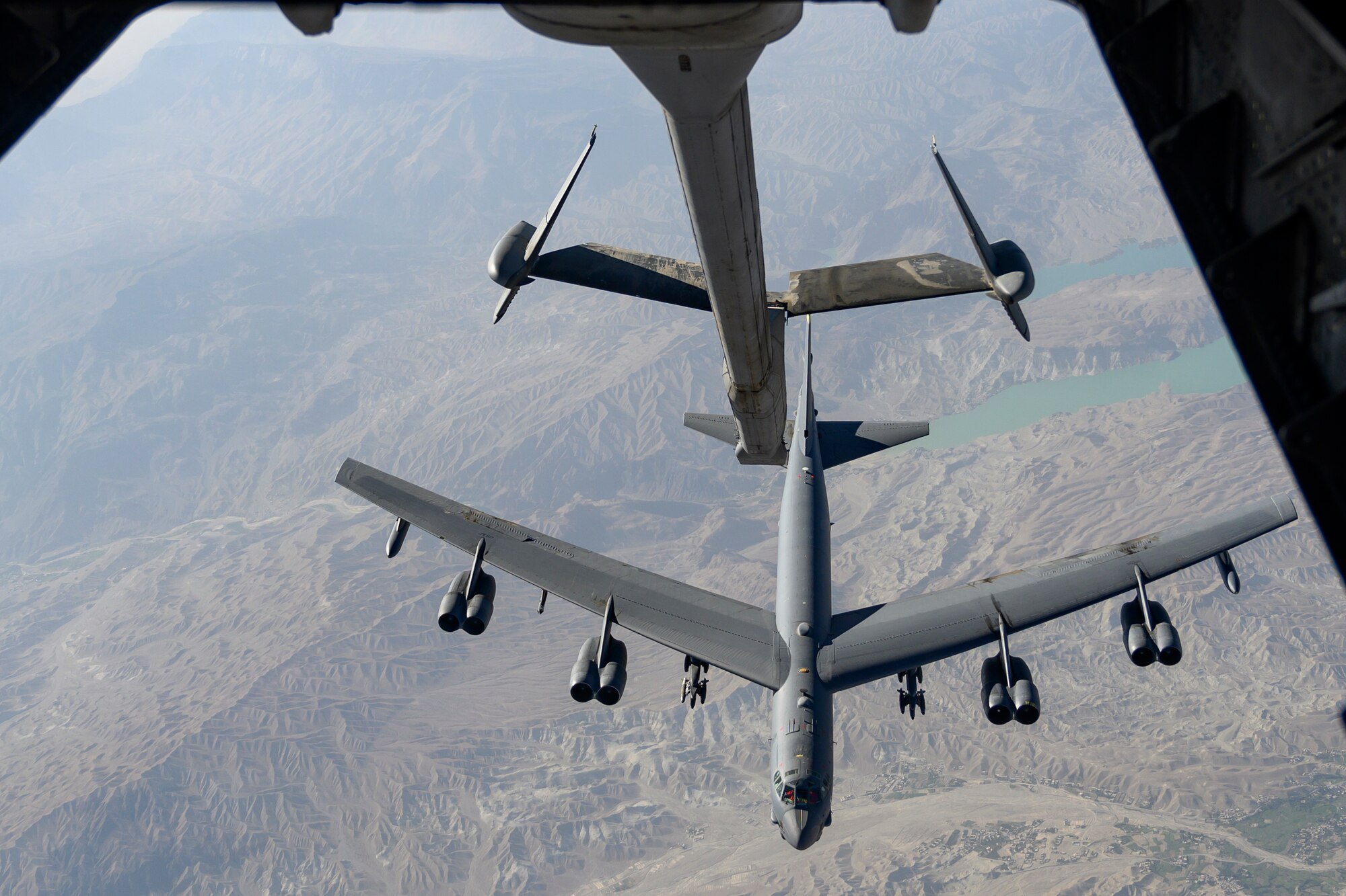 A U.S. Air Force B-52H Stratofortress aircraft approaches a KC-10 Extender aircraft over an undisclosed location in Southwest Asia to receive fuel during a mission on Aug. 13, 2021. Air refueling is critical to agile combat employment because it extends the aircraft’s range and duration of flight. (U.S. Air Force photo by Tech. Sgt. Michelle Y. Alvarez)