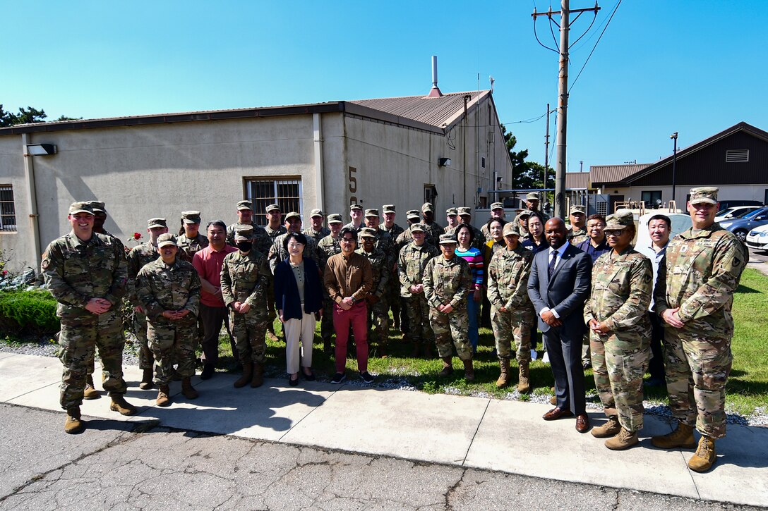 Service members pose for a group photo.