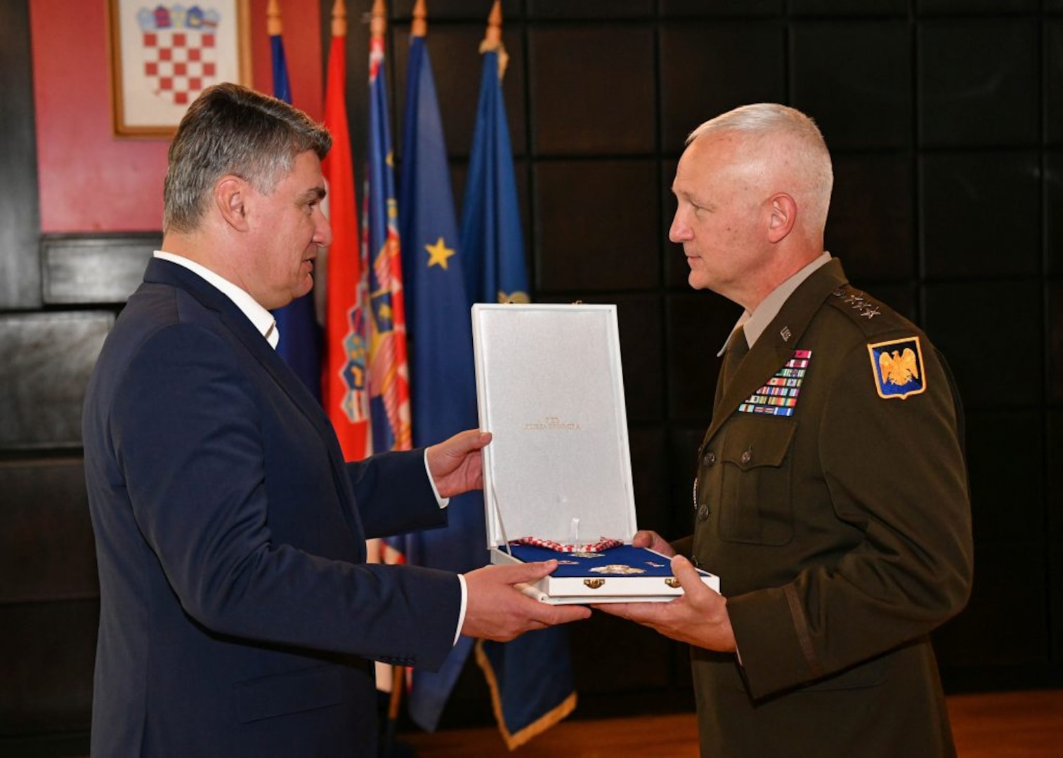 Croatian President Zoran Milanović, left, presents the Duke of Trpimir medal to Army Lt. Gen. Jon Jensen, the director of the Army National Guard, during a ceremony in Split, Croatia, Sept. 27, 2021, in honor of the 25-year partnership between the Minnesota National Guard and Croatia as part of the State Partnership Program. The Department of Defense's State Partnership Program pairs National Guard elements with partner nations worldwide and currently consists of 85 partnerships with 92 nations.