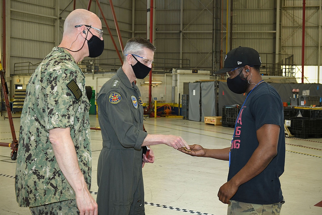 210429-N-DG679-084
JACKSONVILLE, Fla. (April 29, 2021) During Fleet Readiness Center Southeast’s Micro Boots on the Ground event, Vice Adm. Dean Peters, commander, Naval Air Systems Command, presents a coin to Calvin Wheelous, an aircraft mechanic with FRCSE’s F-5 Tiger II Production Line as Capt. Grady Duffey, FRCSE’s Commanding Officer observes, Apr. 29, 2021. (U.S. Navy Photo by Toiete Jackson/Released)