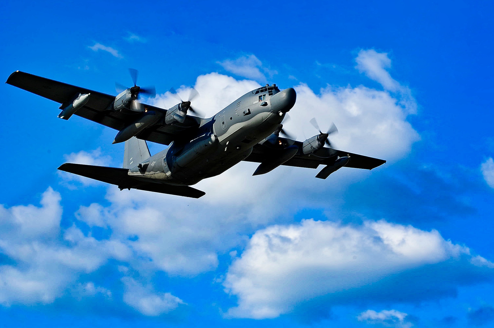 A MC-130H Combat Talon II flies above Hurlburt Field after takeoff.