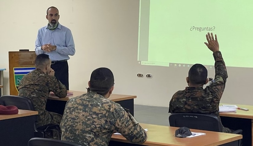 Stephen Cartwright, U.S. Army South Information Security (INFOSEC) manager, answers questions from El Salvadoran intelligence professionals regarding INFOSEC, at the Escuela Nacional de Inteligencia Militar in San Salvador, El Salvador, Sep. 21, 2021. U.S. Army South G2 personnel conducted a working group with El Salvadoran intelligence instructors Sept. 21-25 to enhance the readiness of El Salvadoran intelligence professionals, increase interoperability between the U.S. and Salvadoran armies and strengthen national partnerships. Defense partnerships with U.S. Army South are vital to security and prosperity in the hemisphere and to our collective ability to meet complex global challenges.