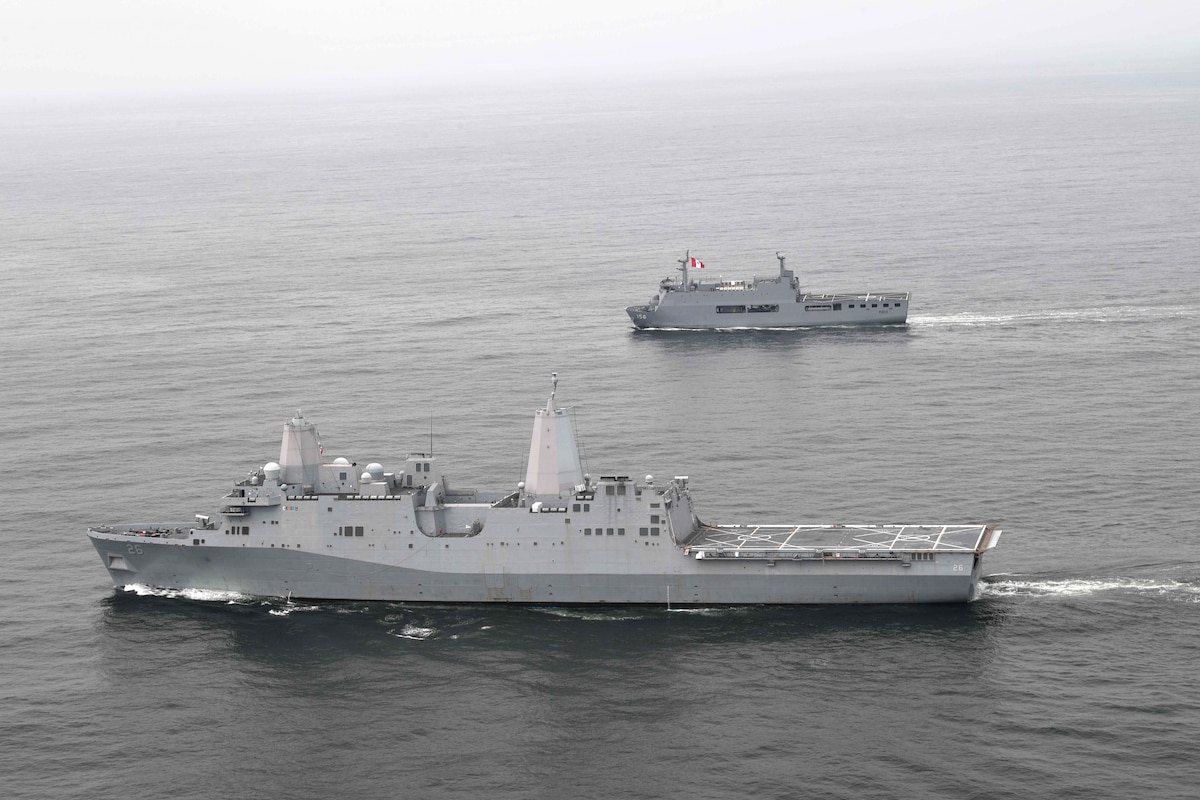 USS John P. Murtha (LPD 26) and the Peruvian navy landing platform dock ship BAP Pisco (AMP-156) conduct tactical maneuvers in the eastern Pacific Ocean during UNITAS LXII.