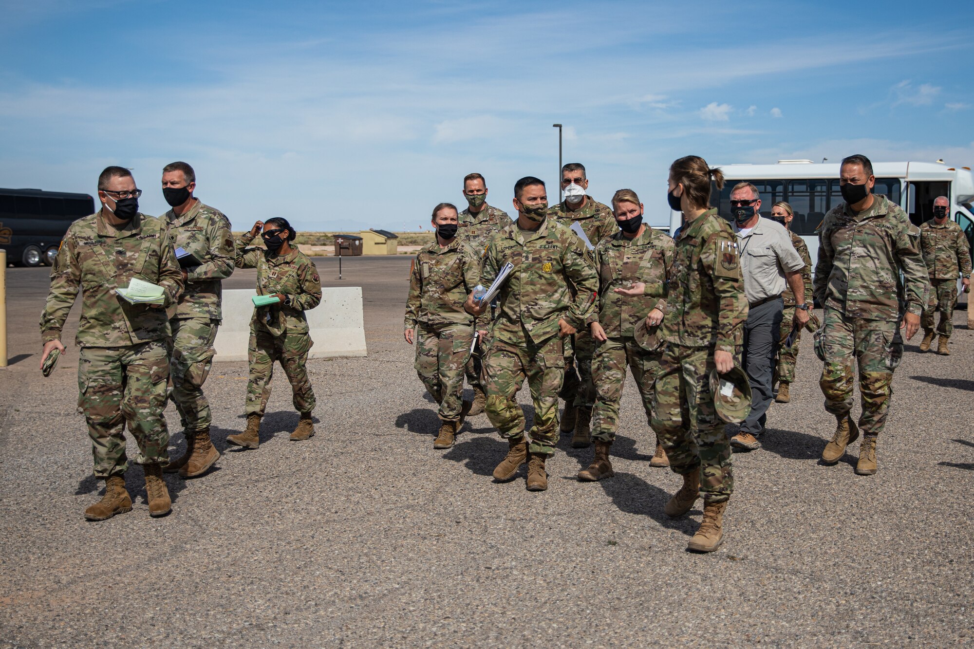 U.S. Air Force 1st Lt. Whitney Longenecker, front right, briefs representatives from U.S. Army North during a visit to Holloman Air Force Base, New Mexico, Sept. 23, 2021. The Department of Defense, through U.S. Northern Command, and in support of the Department of State and Department of Homeland Security, is providing transportation, temporary housing, medical screening, and general support for at least 50,000 Afghan evacuees at suitable facilities, in permanent or temporary structures, as quickly as possible. This initiative provides Afghan evacuees essential support at secure locations outside Afghanistan. (U.S. Army photo by Pfc. Anthony Sanchez)