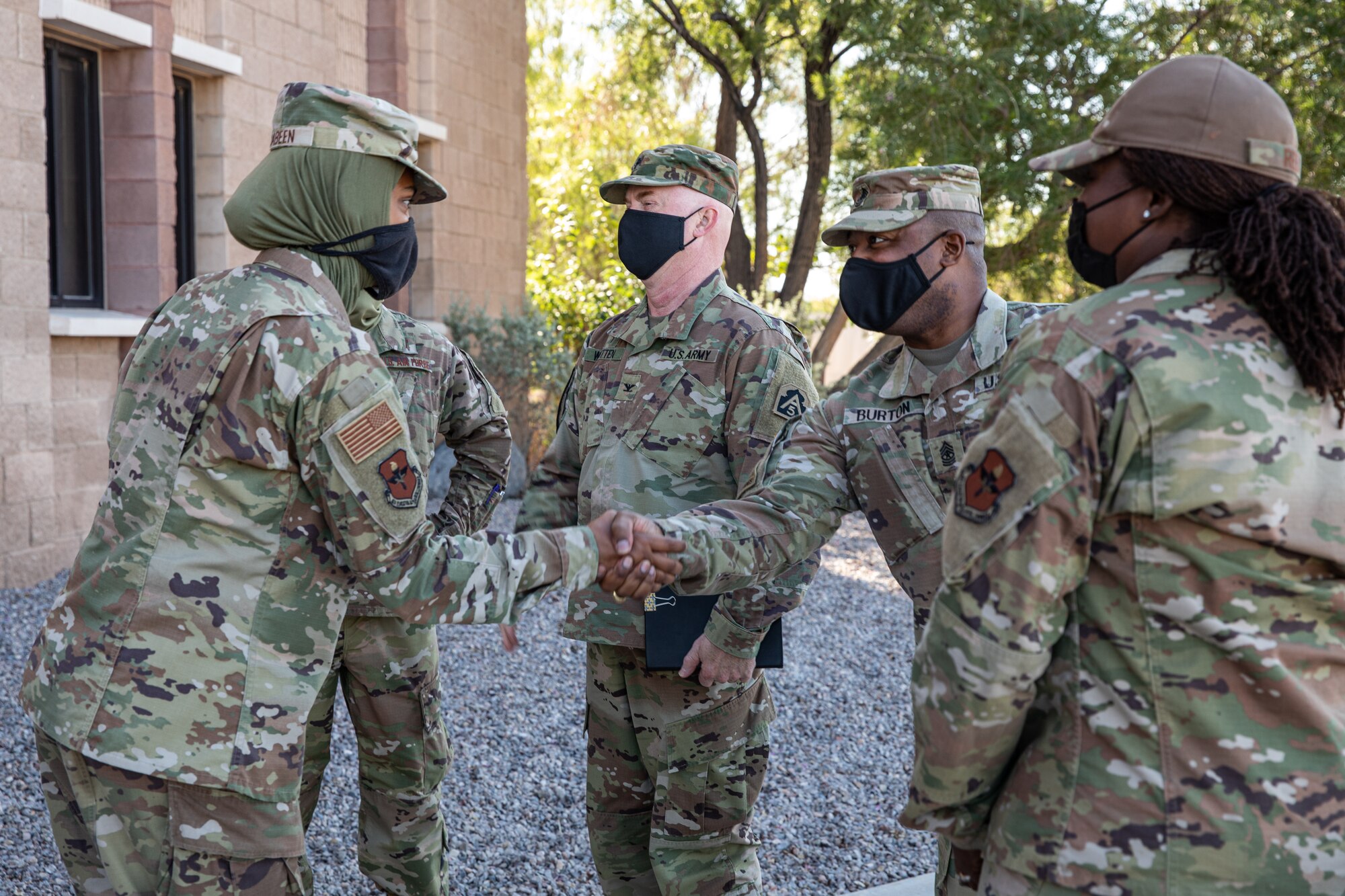 Task Force-Holloman religious affairs Airmen greet the U.S. Army North command chaplain as part of a tour on Holloman Air Force Base, New Mexico, Sept. 22, 2021. The Department of Defense, through the U.S. Northern Command, and in support of the Department of State and Department of Homeland Security, is providing transportation, temporary housing, medical screening, and general support for at least 50,000 Afghan evacuees at suitable facilities, in permanent or temporary structures, as quickly as possible. This initiative provides Afghan evacuees essential support at secure locations outside Afghanistan. (U.S. Army photo by Spc. Nicholas Goodman)