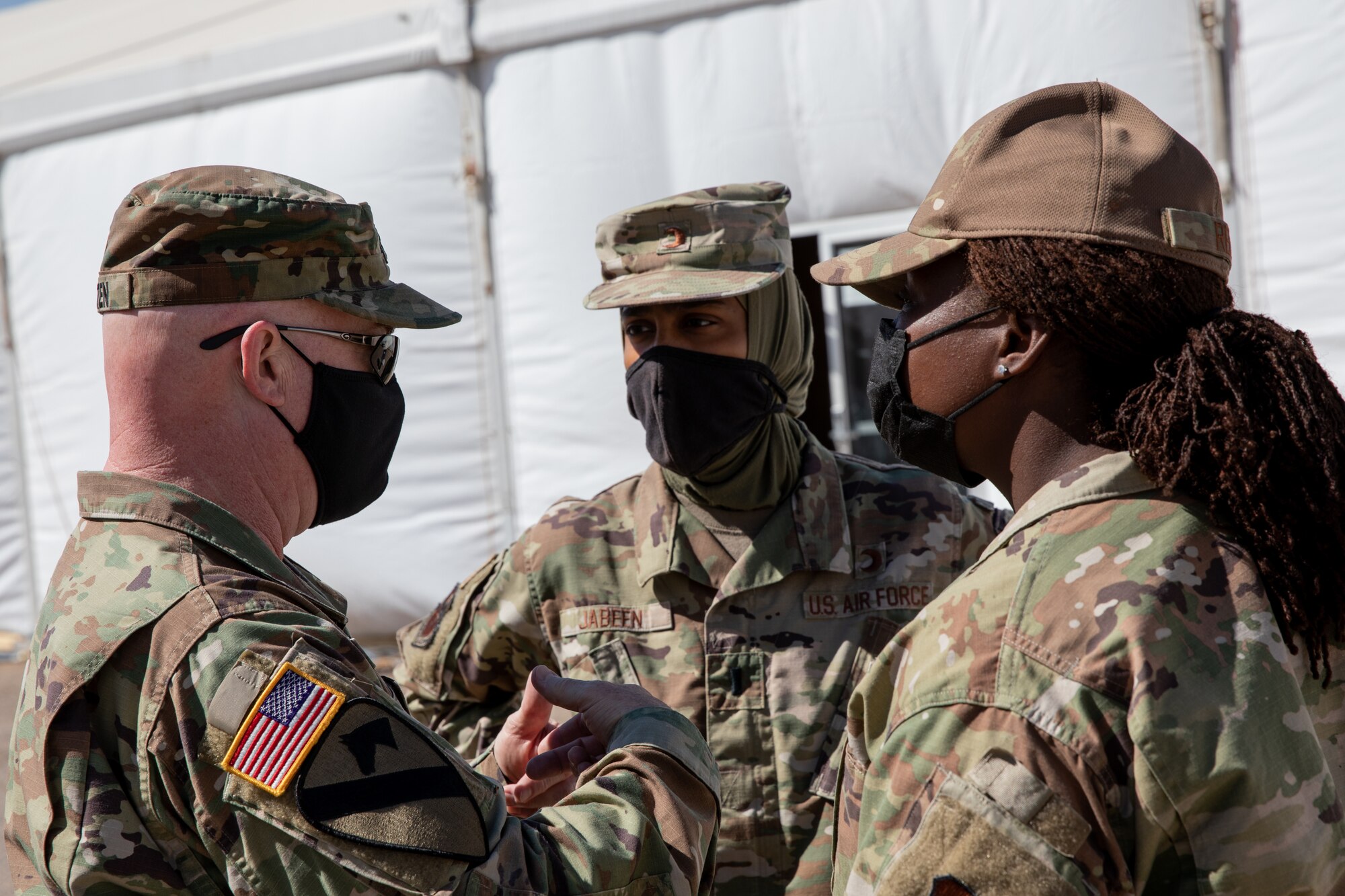 Task Force-Holloman religious affairs Airmen speak with U.S. Army North religious affairs as part of a tour on Holloman Air Force Base, New Mexico, Sept. 22, 2021. The Department of Defense, through the U.S. Northern Command, and in support of the Department of State and Department of Homeland Security, is providing transportation, temporary housing, medical screening, and general support for at least 50,000 Afghan evacuees at suitable facilities, in permanent or temporary structures, as quickly as possible. This initiative provides Afghan evacuees essential support at secure locations outside Afghanistan. (U.S. Army photo by Spc. Nicholas Goodman)