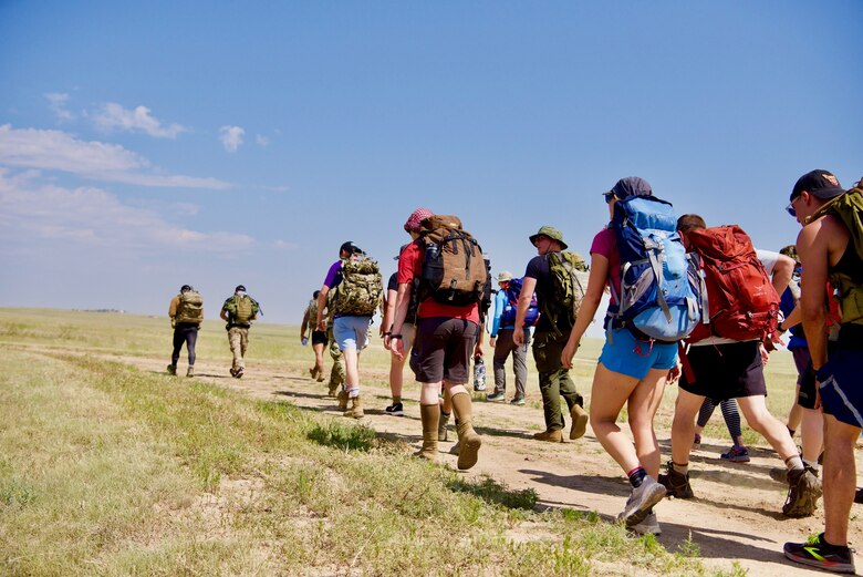 Airmen and Guardians who did not participate in the Schriever Olympic Games went for a ruck march during Wingman Day at Schriever Space Force Base, Colorado, Aug. 6, 2021. Wingman Day is meant to promote events to help Airmen and Guardians connect and boost morale outside of the regular operations. (U.S. Space Force photo by Kristian DePue)