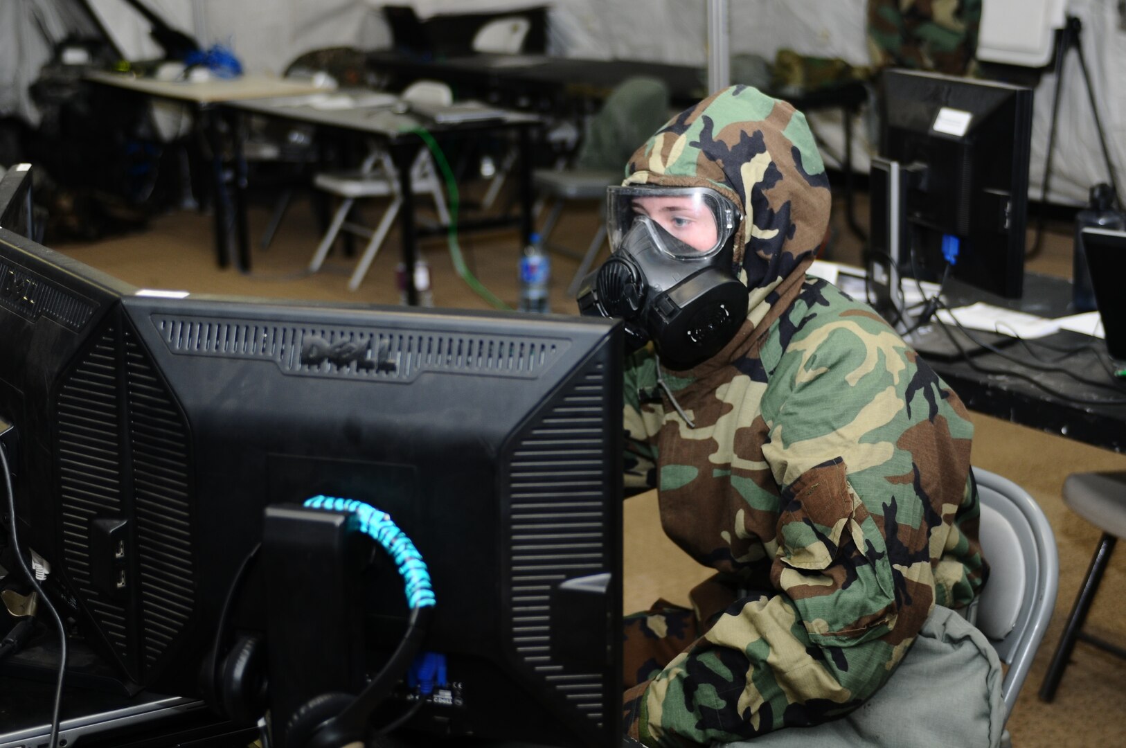 Soldiers of 210th Field Artillery Brigade, 2nd Infantry Division/ ROK-U.S Combined Division, conduct operations in a simulated chemically contaminated environment during a combined counterfire exercise at Thunder Field, Camp Casey, South Korea, Jan. 27, 2016.  (Photo by CPL Jaewoo Oh, USA)