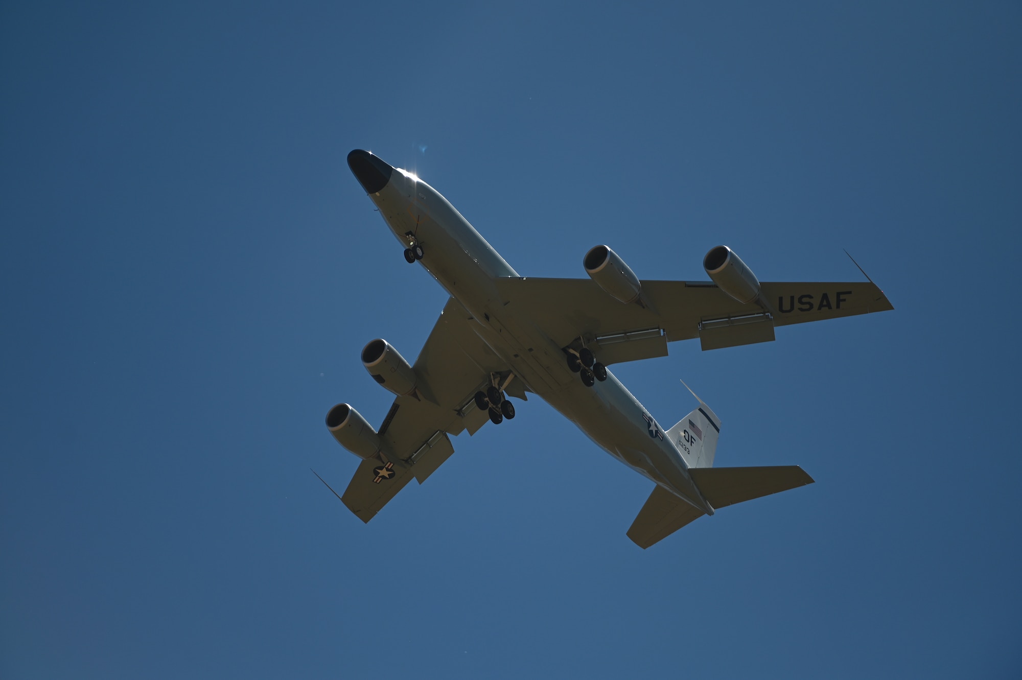 An RC-135S Cobra Ball descends toward the runway