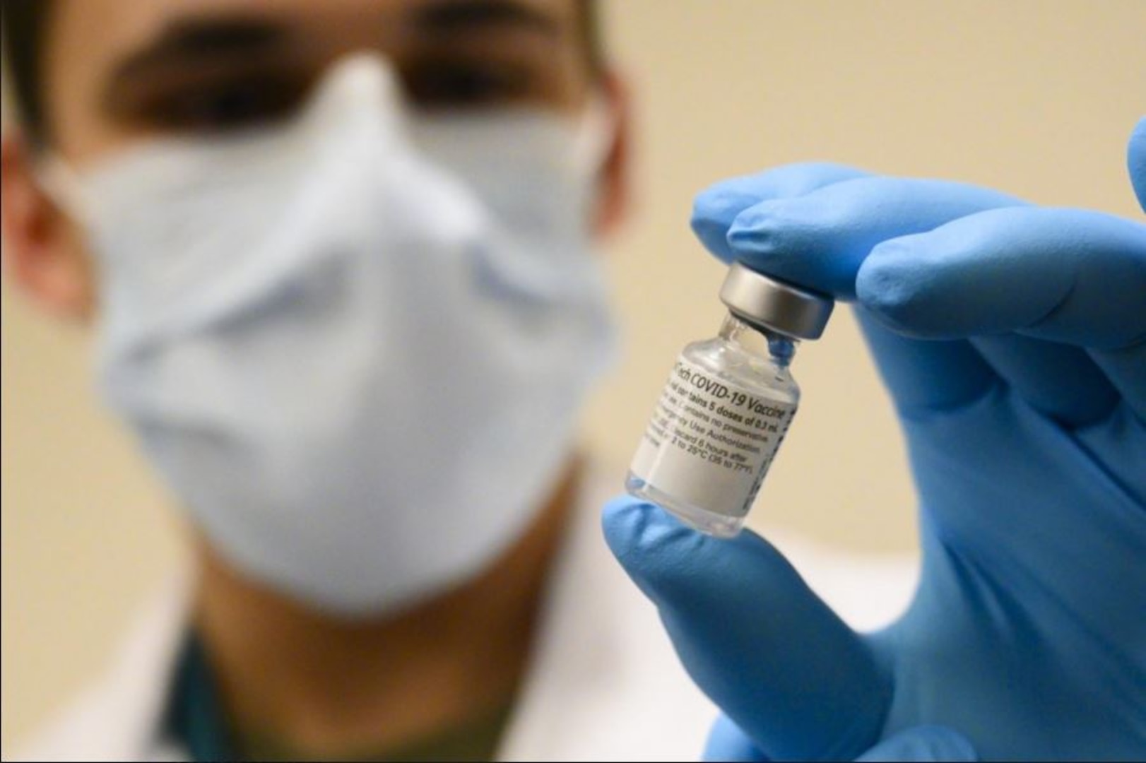 Army Spc. Angel Laureano holds a vial of the COVID-19 vaccine, Walter Reed National Military Medical Center, Bethesda, Md., Dec. 14, 2020. (DoD photo by Lisa Ferdinando) (Lisa Ferdinando)