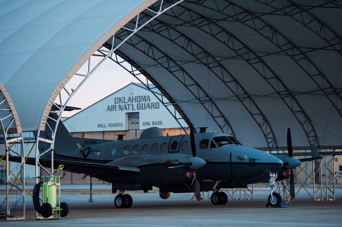 A MC-12W awaits a preflight inspection